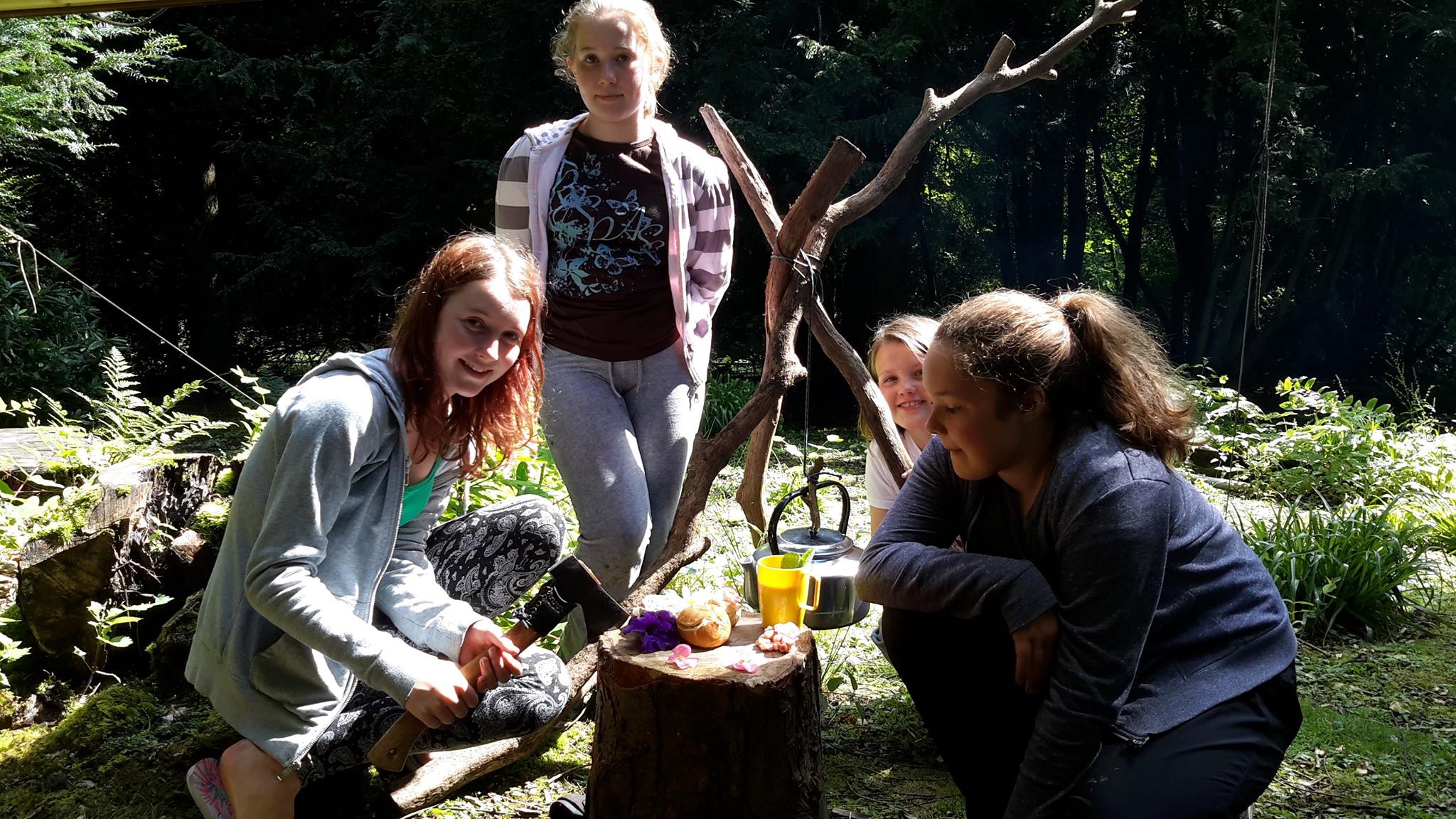 Girls Bushcraft cooking in Derwent Hill's woods