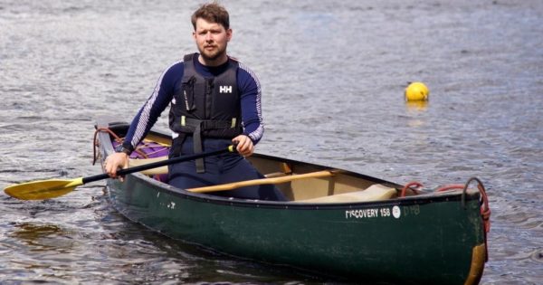 An apprentice solo canoeing on Derwent Water
