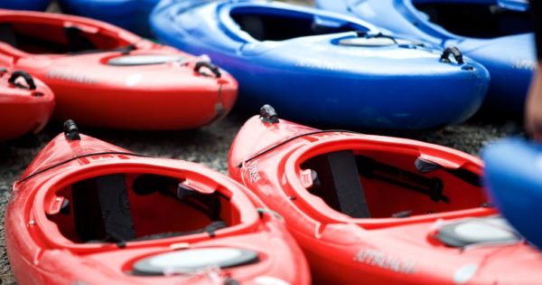 Red and Blue Kayaks ready for an outdoor adventure