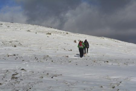 Two winter walkers on a snow covered Dale Head