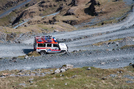A Cockermouth Mountain Rescue Team Landrover driving down a very steep Honister Slate mine track