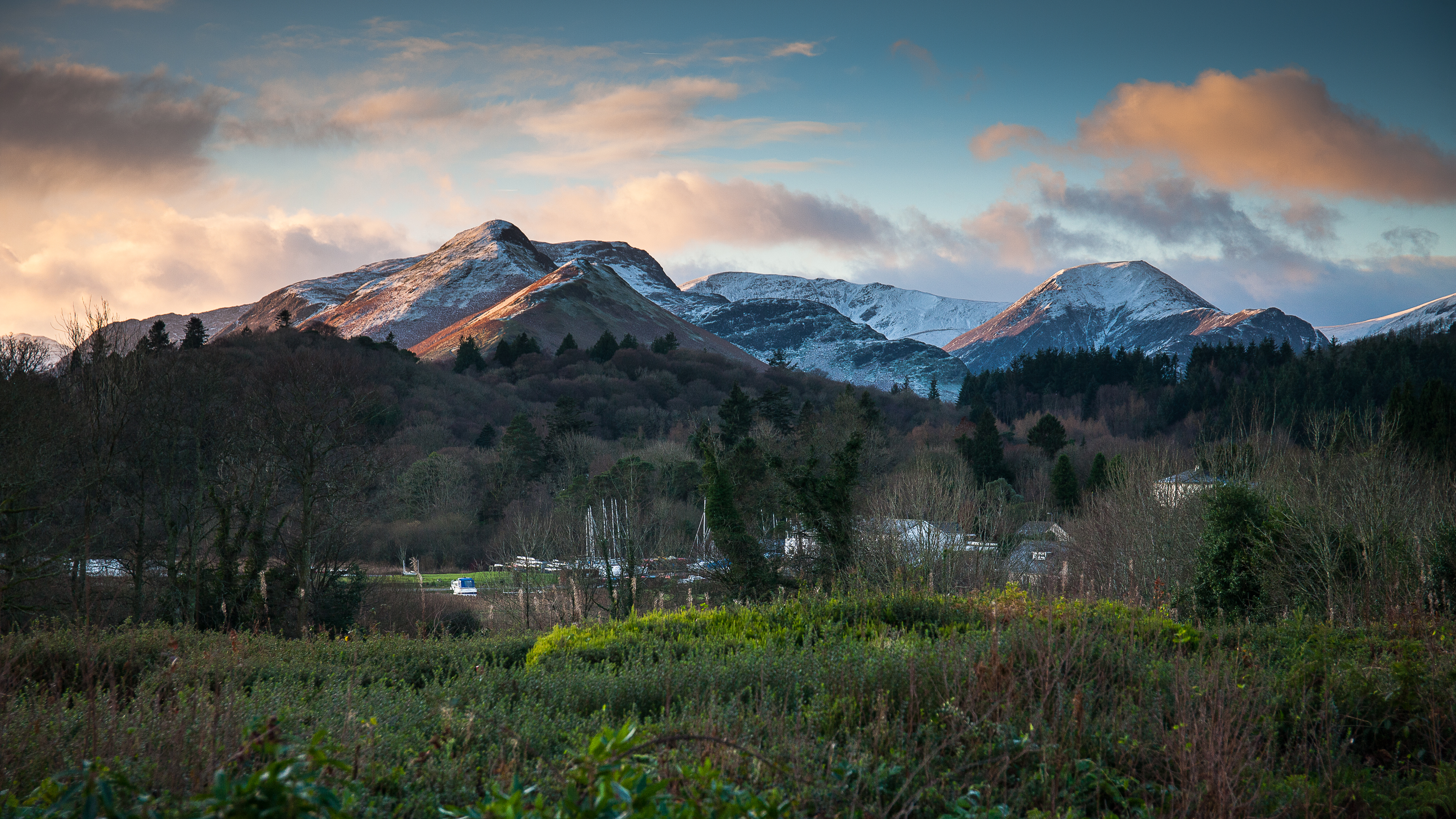 Sun rays breaking through and lighting up the Lake District mountains