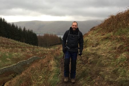 Neale walking in the hills